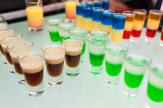 Cocktail multicolored alcohol shots at the disco