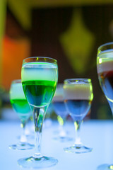 Cocktail multicolored alcohol shots at the disco