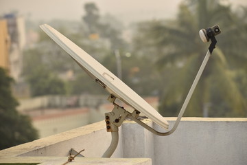 Installed dish or DTH or Direct to home tv on the roof, which is used for receiving TV programs.