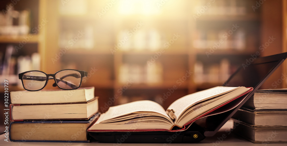 Poster stack of books in the library and blur bookshelf background