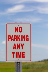 No Parking Sign against beautiful Blue Sky