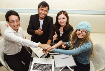 group of business people working together in office - 302213369