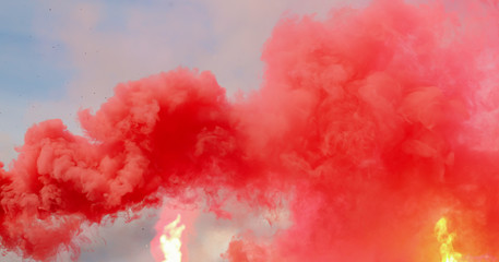 Red smoke on a blue sky