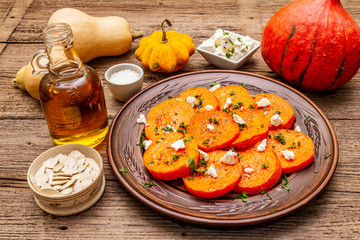 Roasted pumpkin with salted cheese and herbs