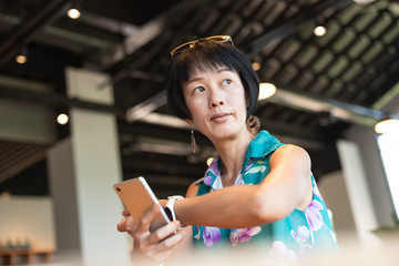 woman using smartphone with smart watch