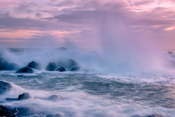 Choppy seas and breaking waves at sunset