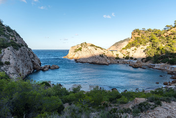 Fototapeta na wymiar Turquoise waters in Es Portitxol, Ibiza, Spain. Hidden bay on the Island of Ibiza, in Sant Joan de Labritja.