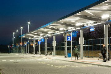 modern small bus station at night with led lights