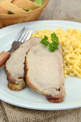 plate of roast pork and pasta
