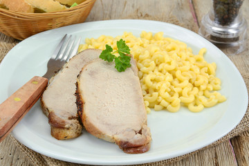 plate of roast pork and pasta