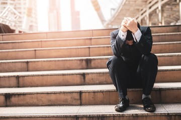 image of businessman in depression on the stair