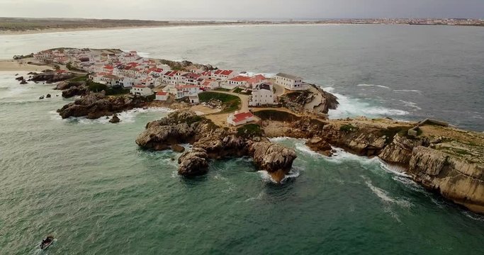Aerial view to ocean and peninsula Peniche Portugal. Village with white houses