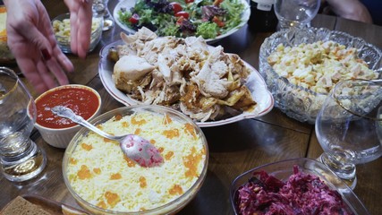 Dining table with a variety of delicious dishes. Close-up.