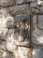 A bas-relief depicting the life of Jesus Christ on a wall in Gethsemane at the foot of the mountain Mount Eleon - Mount of Olives in East Jerusalem in Israel