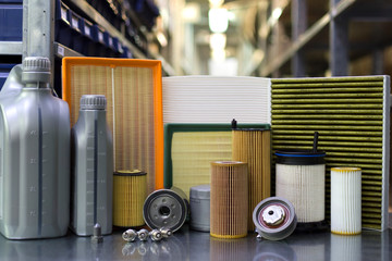 Oil filter, air filter, cabin filter, fuel filter, spark plugs, engine oil. Auto parts close up.