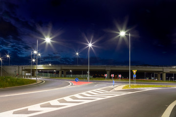 modern crossroad with led streetlights at night