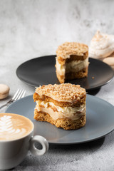 Banana or nut cake on gray plate on marble background. Selective focus. Vertical photo. Menu for bakery. cafe menu. Pastry. Delicious and sweet dessert at cafe restaurant.