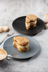 Banana or nut cake on gray plate on marble background. Selective focus. Vertical photo. Menu for bakery. cafe menu. Pastry. Delicious and sweet dessert at cafe restaurant.
