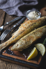 Fried fish with sauce and lemon