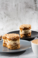 Banana or nut cake on gray plate on marble background. Selective focus. Vertical photo. Menu for bakery. cafe menu. Pastry. Delicious and sweet dessert at cafe restaurant.