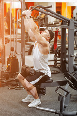 Muscular man working in gym. Sport power