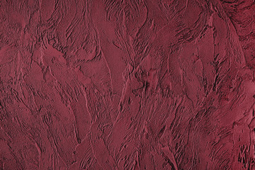Dark red colored low contrast Concrete textured background with roughness and irregularities to your design or product. Color trend concept.