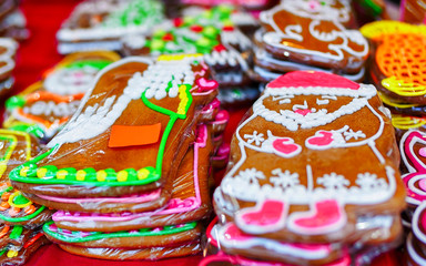 Fototapeta na wymiar Festively decorated gingerbreads on display at the Christmas market in Riga, Latvia. The market takes place each year from the beginning of December till the start of January.
