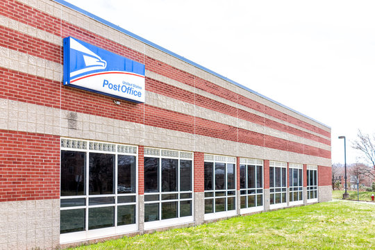 Sterling, USA - April 4, 2018: United States Postal Service USPS office exterior in Loudoun County, Virginia with nobody, sign, blue logo
