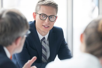 Businessman listening on meeting in office