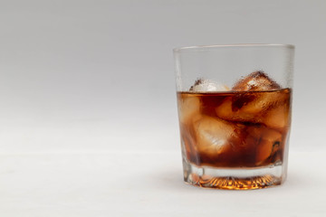 A close up in a glass of cold cola