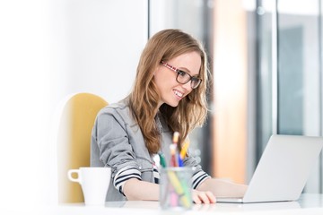 Young entrepreneur sitting while working in office
