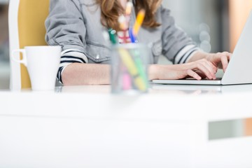 Young entrepreneur sitting while working in office
