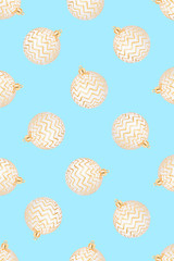 Pattern of Christmas balls on blue background. Flat lay, top view.
