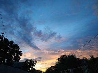 the atmosphere of the evening in an urban home environment with beautiful sky and orange clouds