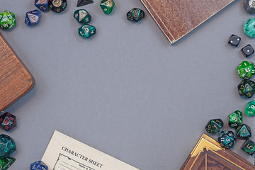 Flat lay concept design for tabletop role playing with colorful green and blue dices, character...
