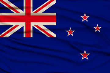 beautiful photograph of the New Zealand national flag on delicate shiny silk with soft draperies, the concept of state power, country life, horizontal, close-up, copy space
