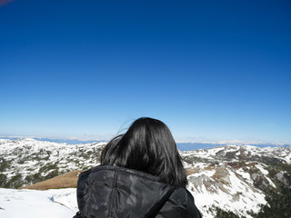Fototapeta na wymiar Traveler looking at view of Shika snow mountain
