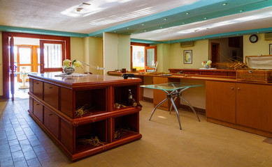 interior of the modern Spa center with a hall, tables, chairs, corridors, beautiful design of dark wood. Europe Greece