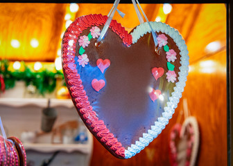 Heart shape Gingerbread cookie in Christmas market Germany Europe in winter. German Night street...