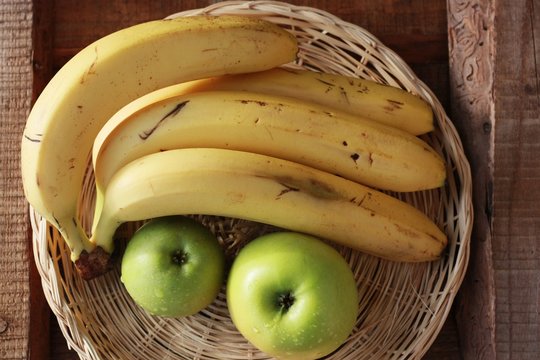 Green Apples And Bananas On The Table