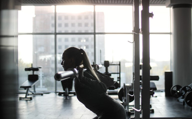 Woman of middle age working out in gym.