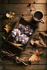 Chocolate cookies with cracks on a dark wooden background. winter concept