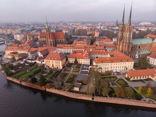 Fototapeta na wymiar The aerial view of Wroclaw: Ostrow Tumski, Cathedral of St. John the Baptist and Collegiate Church of the Holy Cross and St. Bartholomew