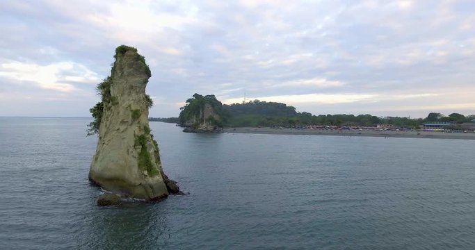 Panoramic View of the Beach and Stone Shaped Like a Piece of Cheese