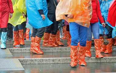 colorful waterproof gaiters and tourists during a visit to Venic