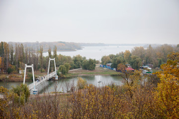 Azov City. Rostov region. Russia. View of the bridge on river Don. Cloudy and foggy day in autumn, 2019