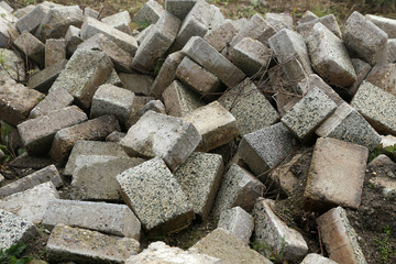 A pile of old paving stones at a construction site