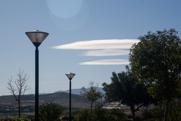 landscape with white clouds similar to UFO