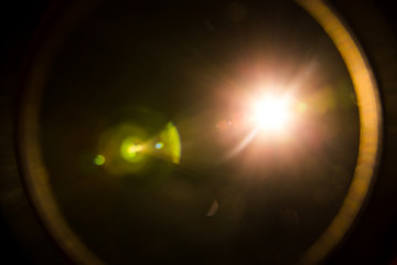 Abstract Natural Sun flare on the black background.