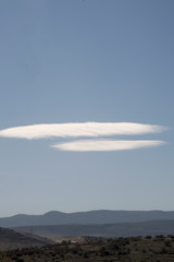 landscape with white clouds similar to UFO